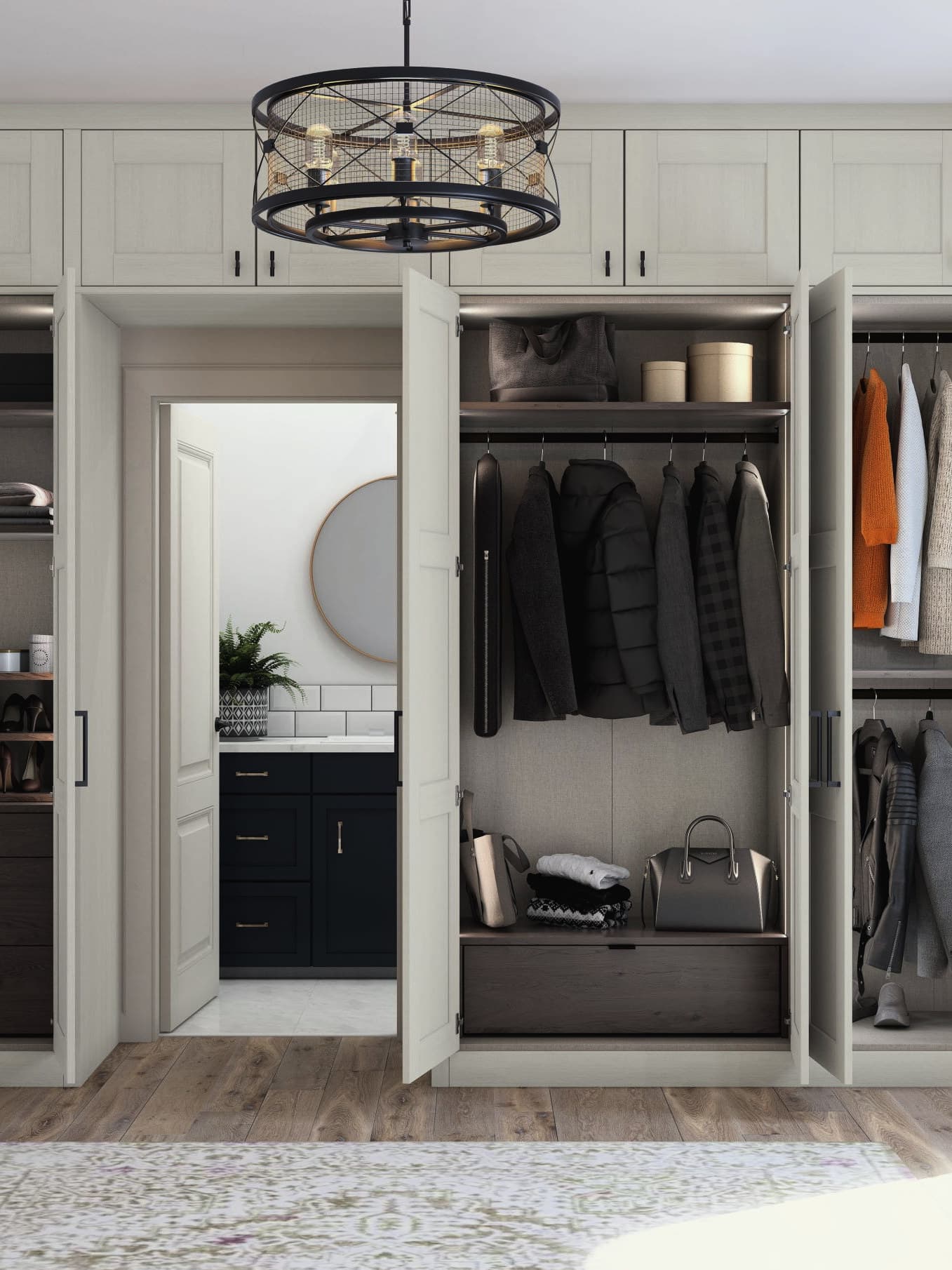 Fitted wardrobes with the doors open, showing walnut-lined interiors, lit shelving, hanging rails, drawers and pull-out shoe storage